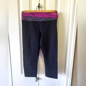 LULULEMON Size 4 Cropped Black Leggings With Pink/Purple Waist Band